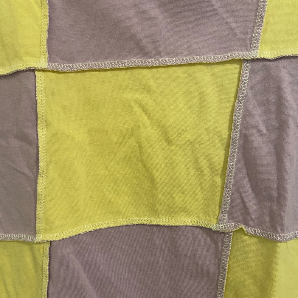 This shirt is in a size Medium, from forever 21, in color yellow & purple